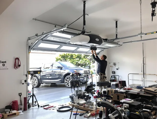 San Juan Capistrano Garage Door Repair specialist installing smart garage door opener system in San Juan Capistrano home